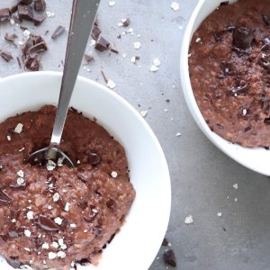 Chocolate oatmeal in a white bowl.