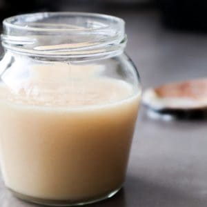 Homemade condensed milk in a glass.