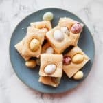 Easter mini egg fudge on a blue plate.