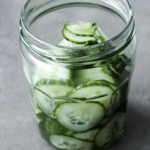 Asian cucumber salad in a glass jar.