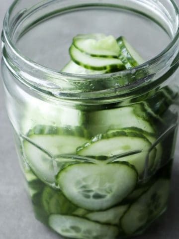 Asian cucumber salad in a glass jar.