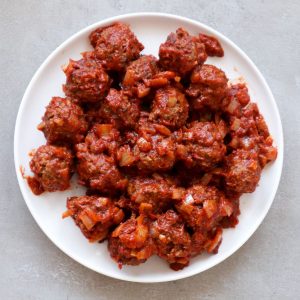 Overhead shot of Spanish meatballs in tomatosauce.