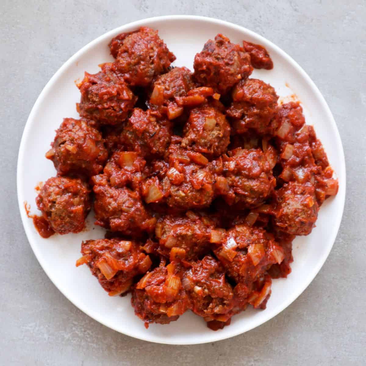 Overhead shot of Spanish meatballs in tomatosauce.