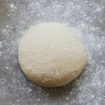 A close up of a ball of homemade pizza dough.