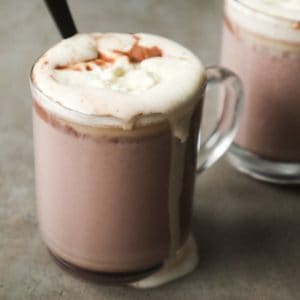 Two cups of Nutella hot chocolate with whipped cream.