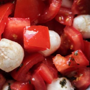 Overhead shot of a salade caprese with mozzarella and balsamic glaze.