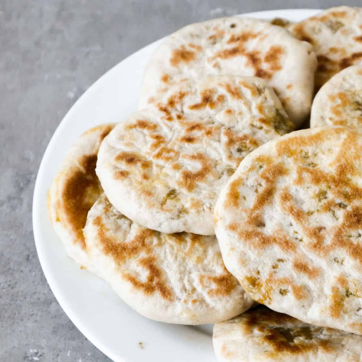 A stack of babout on a white plate.
