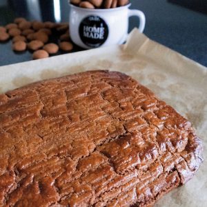 A large piece of gevuld speculaas on a baking tray.
