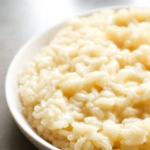 A plate of garlic parmesan risotto taken from the side.