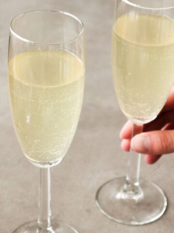 Side shot of two french 75 with vodka cocktails.