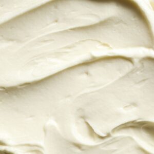 An overhead shot of white almond buttercream frostinf so you can see the texture.