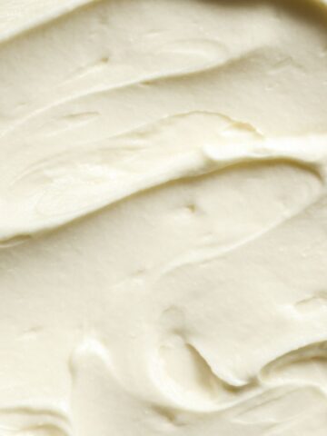 An overhead shot of white almond buttercream frostinf so you can see the texture.