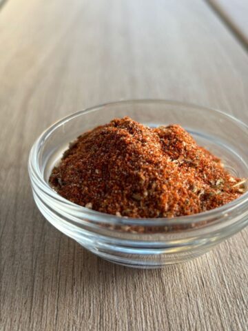 Taco seasoning for chicken on a wooden background.
