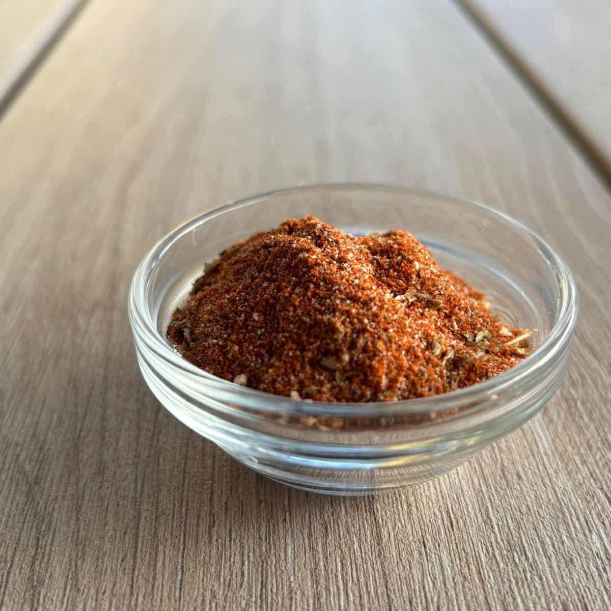 Taco seasoning for chicken on a wooden background.