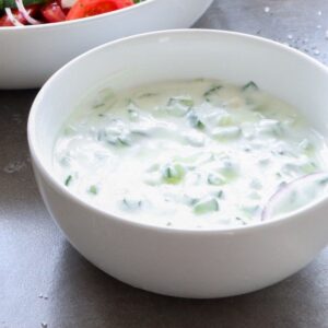Dairy-free tzatziki sauce in a white bowl.