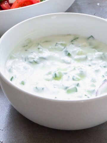 Dairy-free tzatziki sauce in a white bowl.