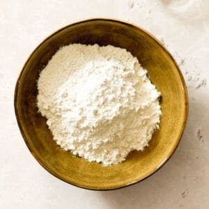 Homemade self-rising flour in a yellow bowl.
