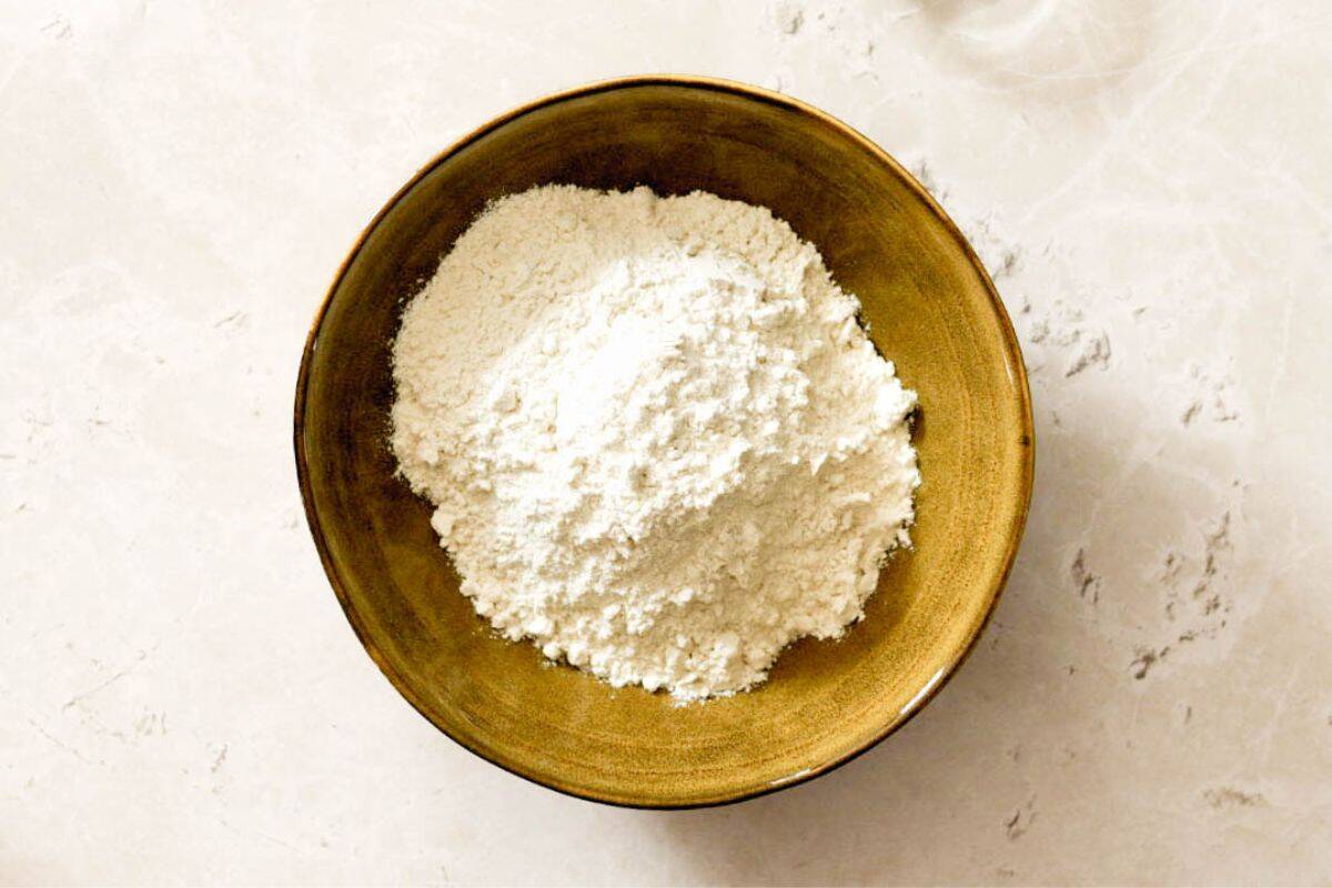overhead shot of homemade self-rising flour with a spoon