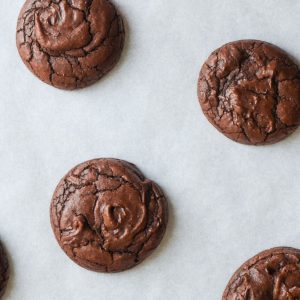 A couple of vegan brownies cookies on a white background.