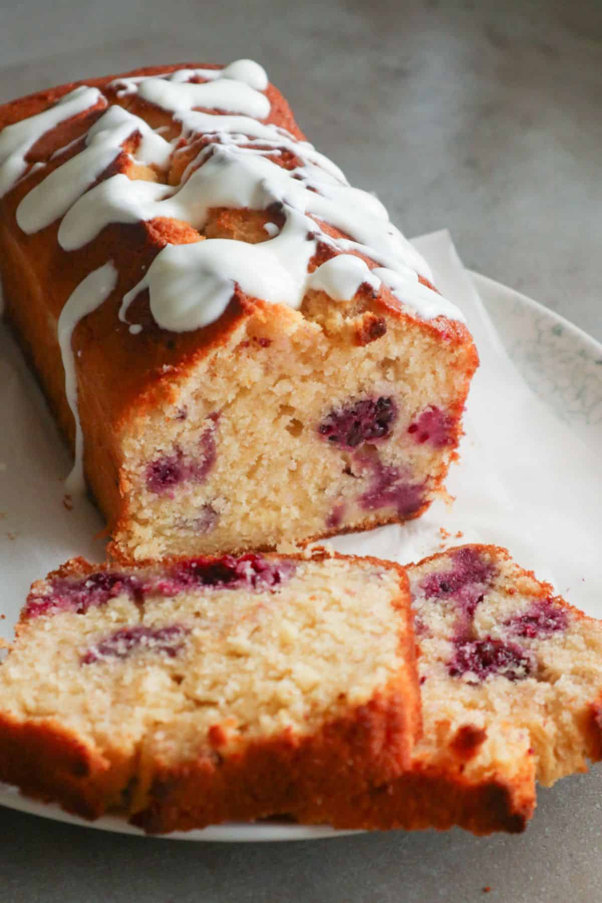 A lemon blackberry cake with Greek yogurt glaze.