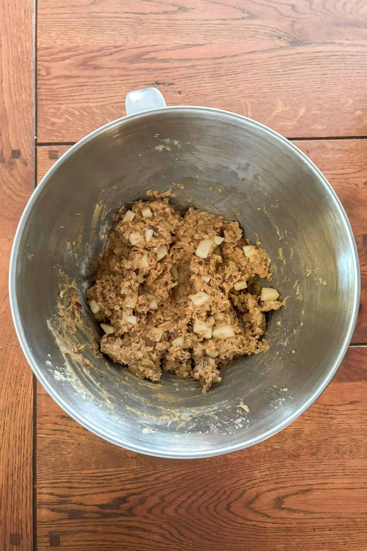 Apple caramel oatmeal cookie dough in a bowl.