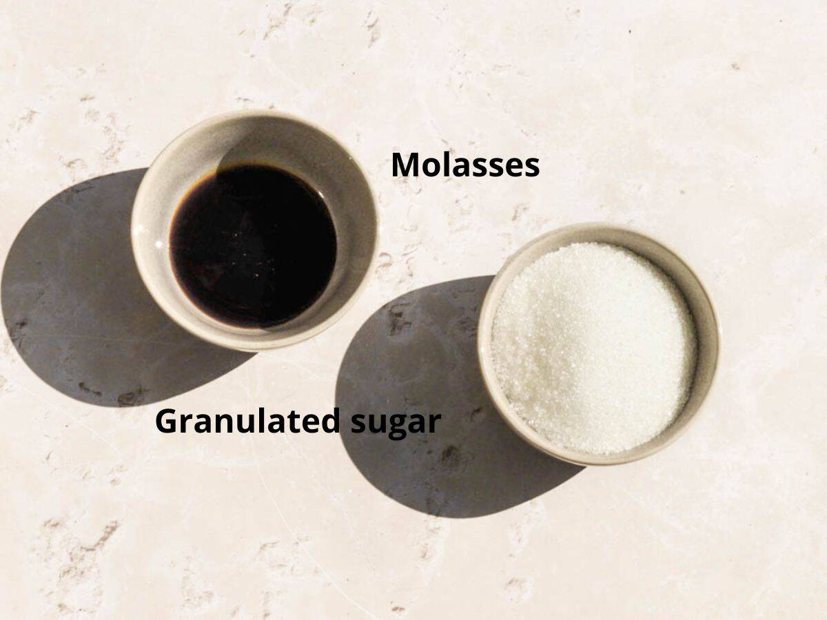 Molasses and granulated sugar in two bowls.
