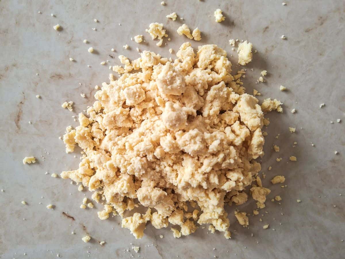 Kneading sand cookies dough.