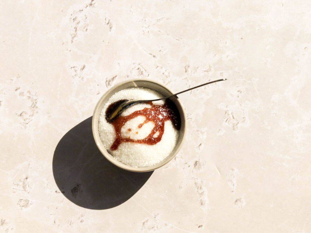 Adding molasses to the granulated sugar.